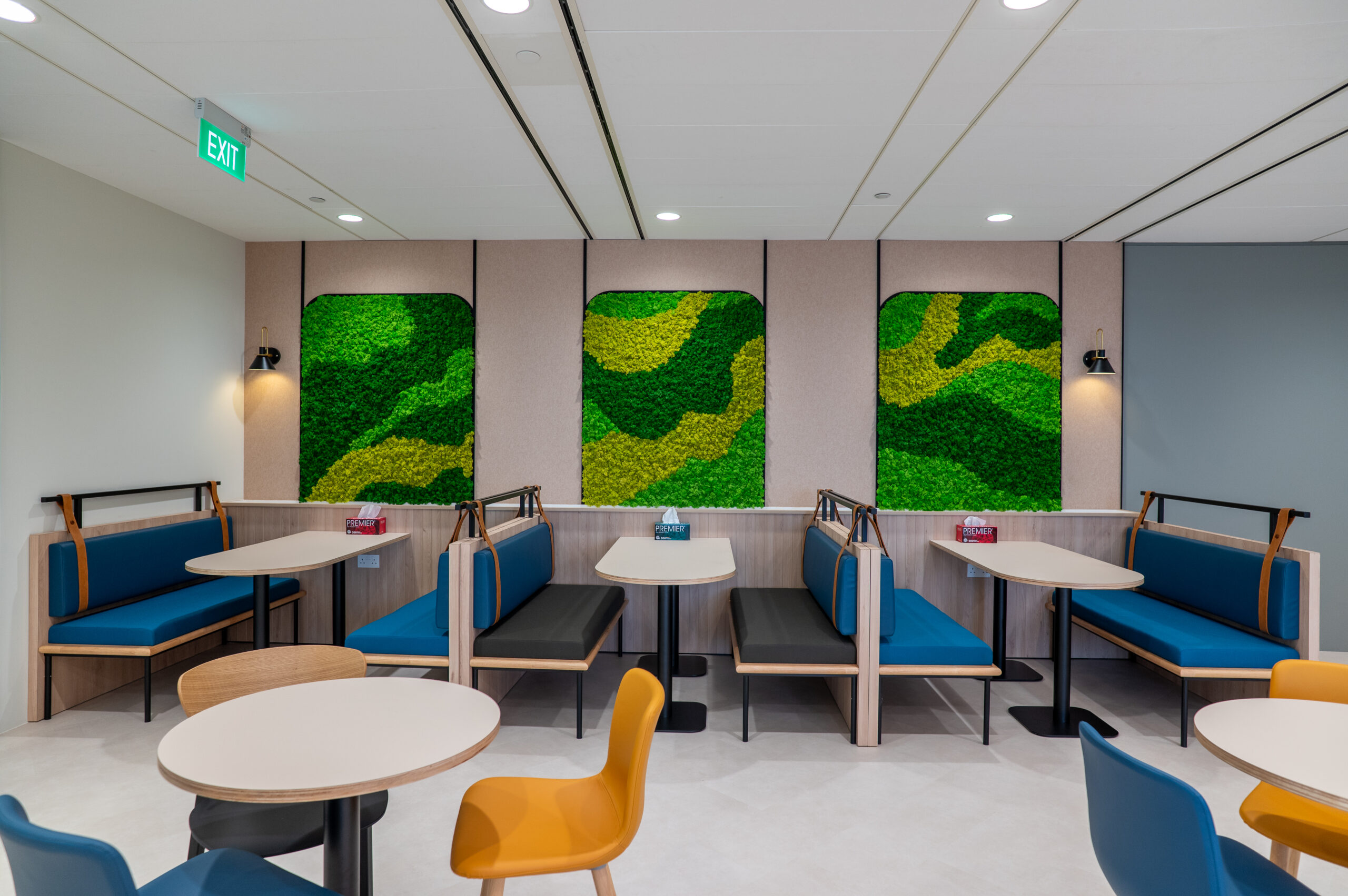 Resi-mercial office breakout booths with preserved moss wall panels