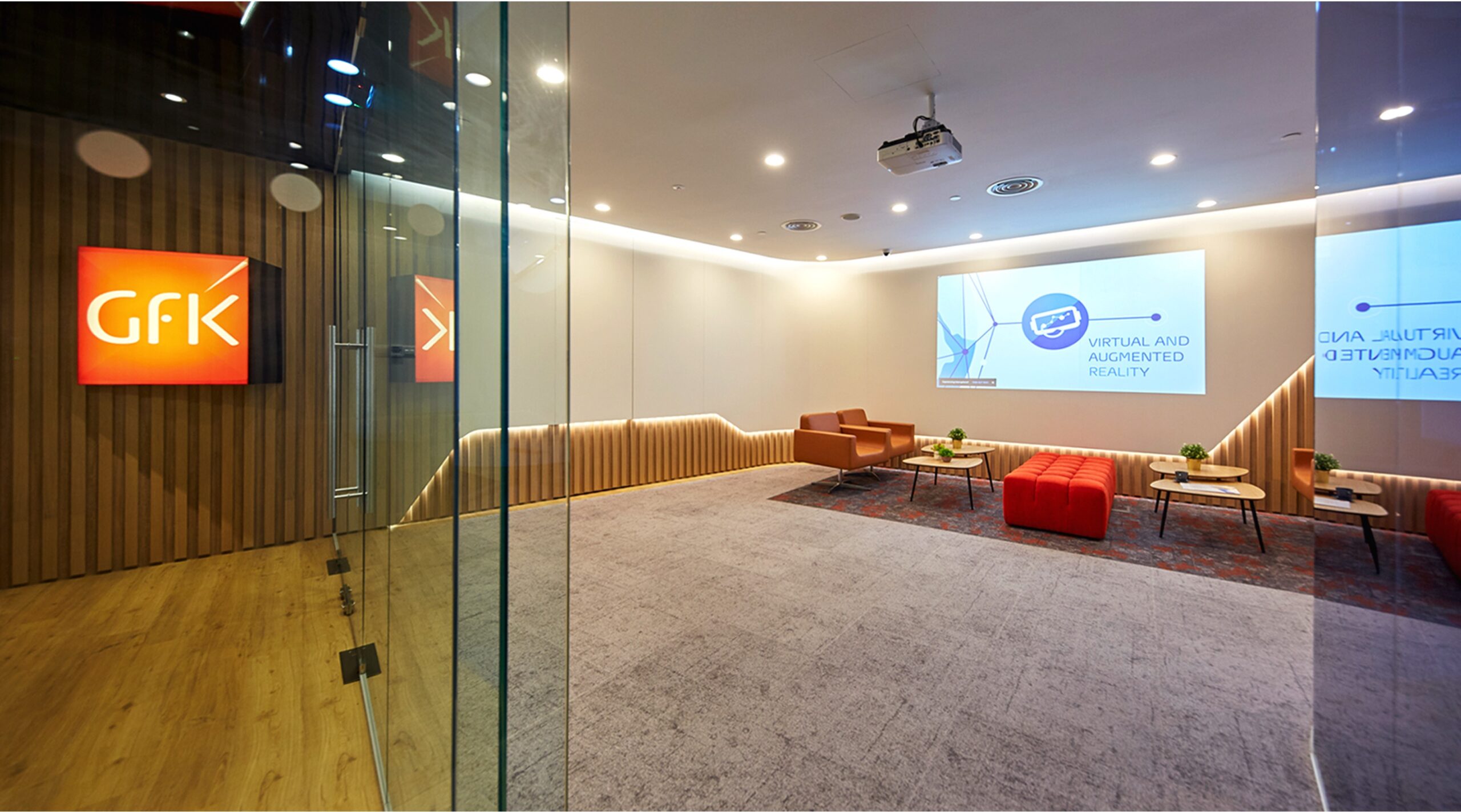 GfK office interior design with flexible lounge and glass meeting rooms in Singapore