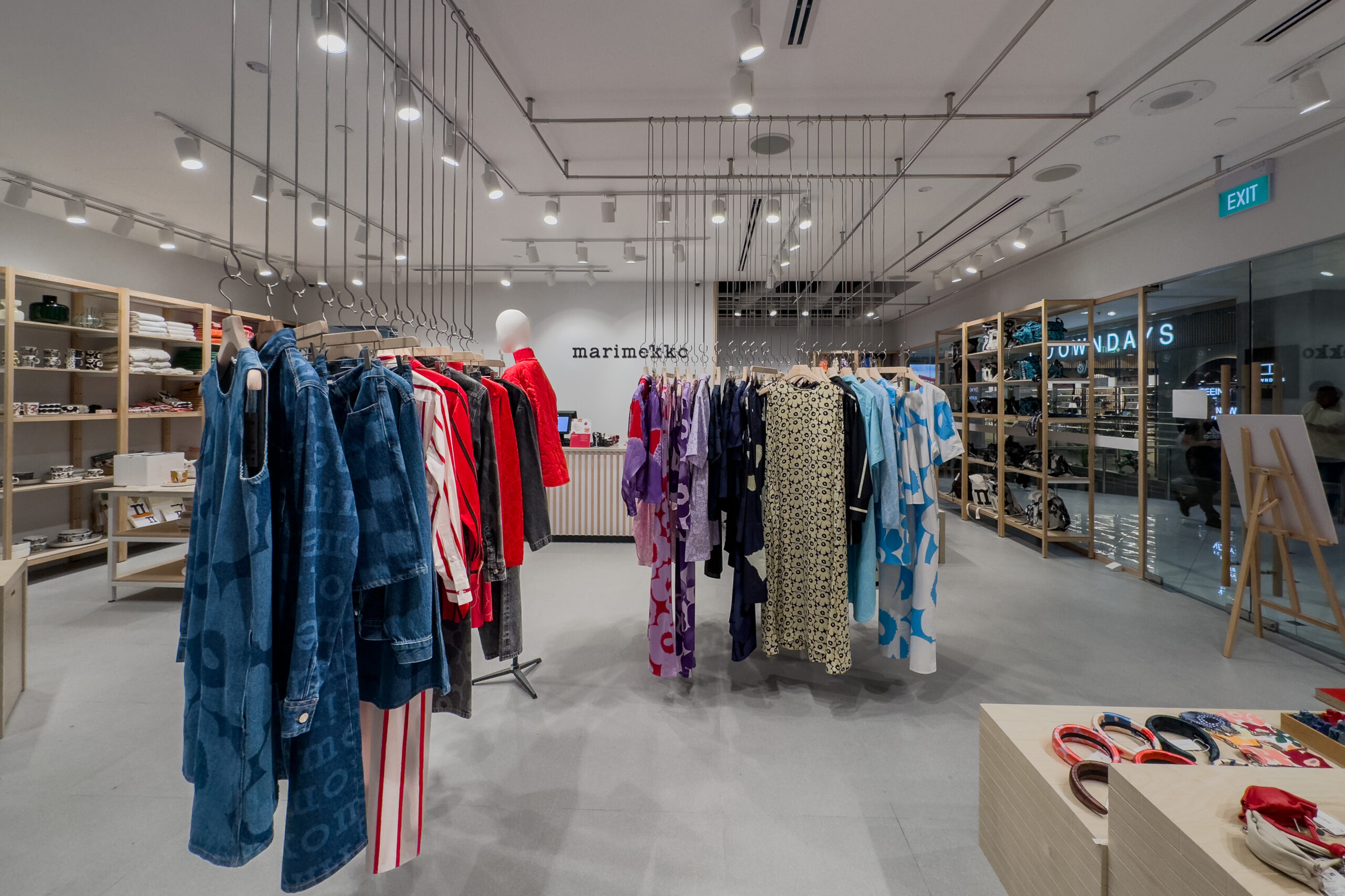Marimekko fashion boutique with ceiling-hung clothing displays in Singapore