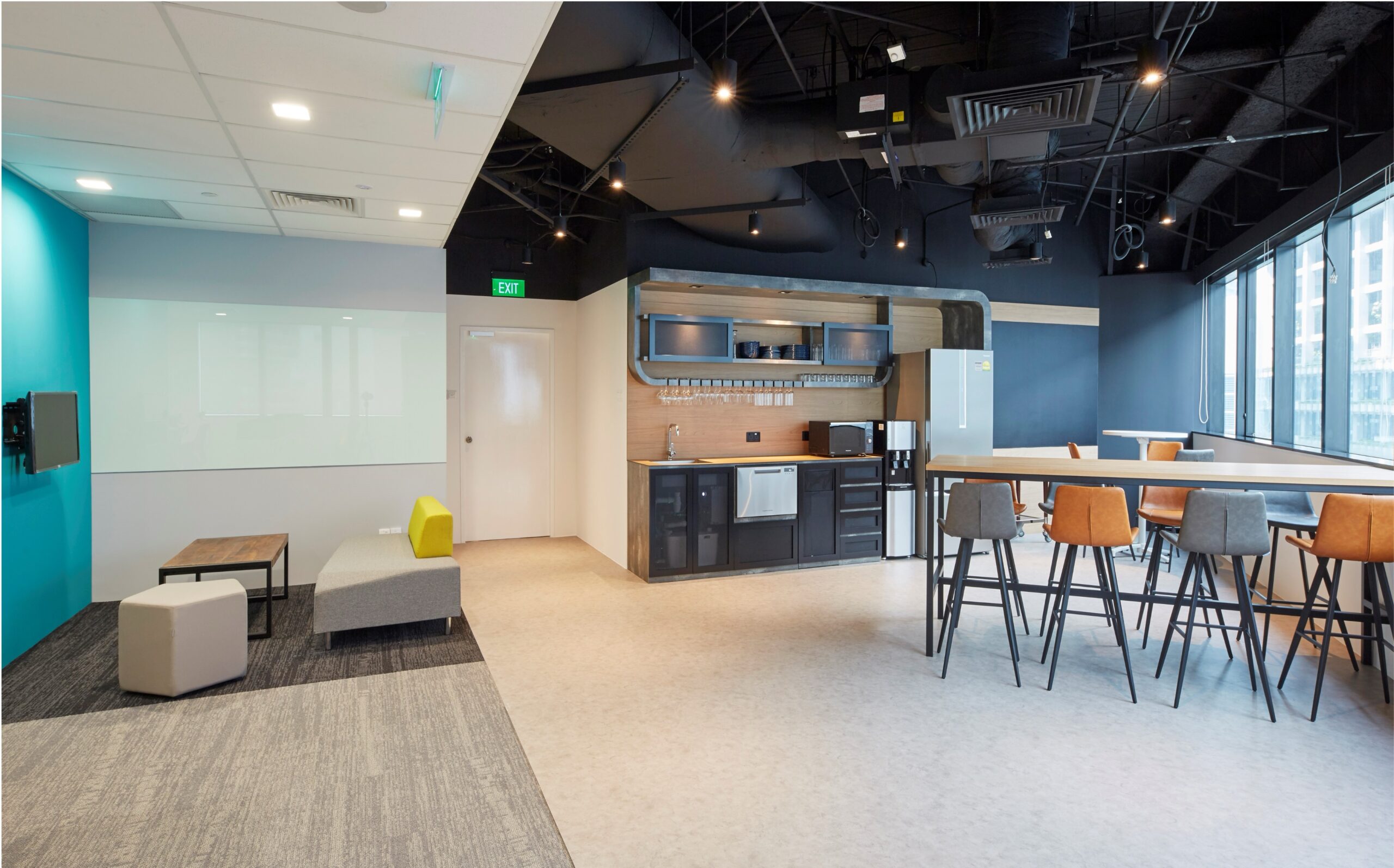 L.E.K. Consulting informal breakout area and pantry with high counter seating