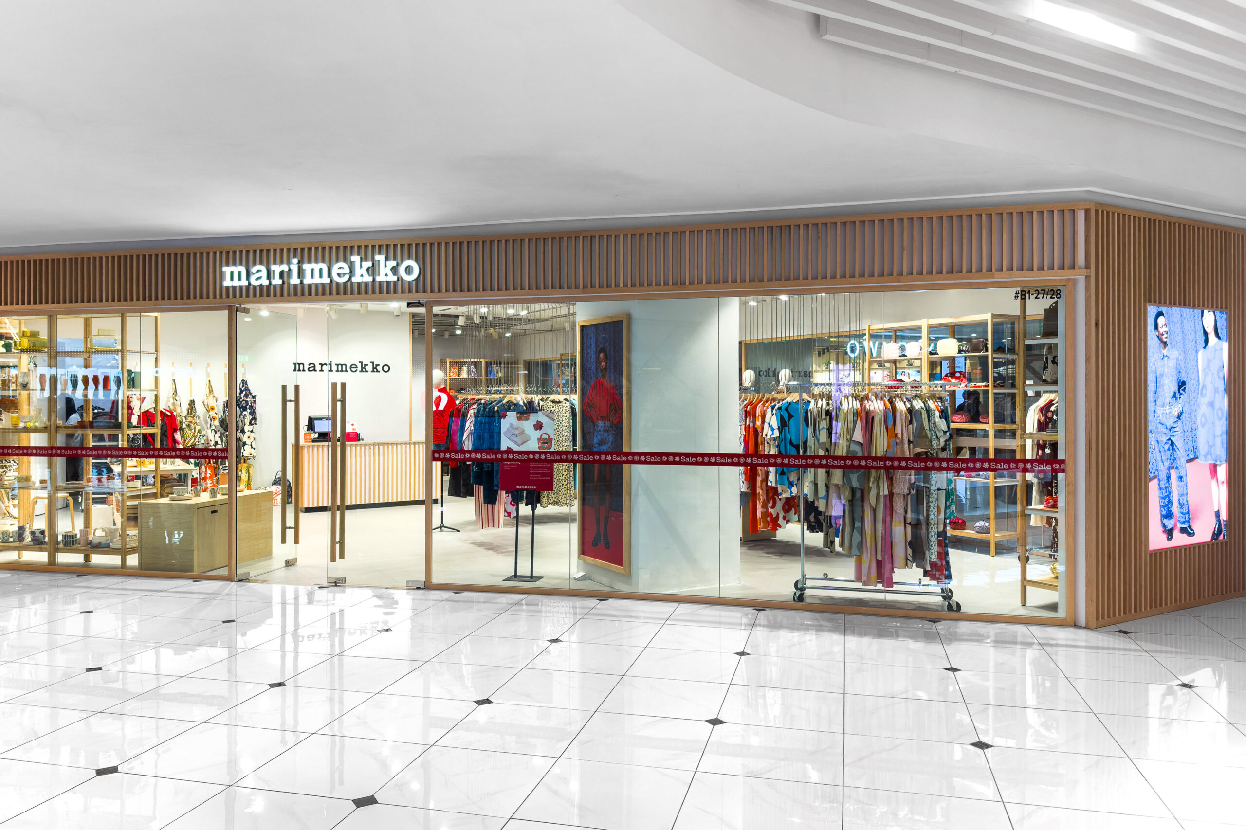 Open Marimekko retail store layout with Nordic finishes and bold prints