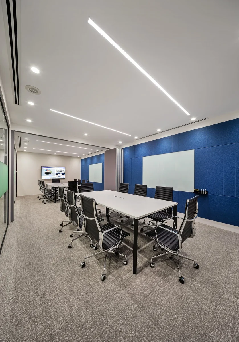 Brother office meeting room with blue acoustic panels and presentation screen