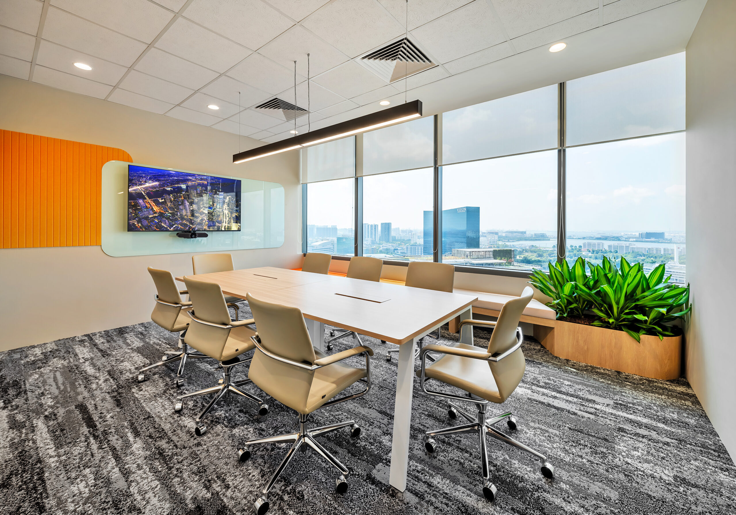 Epiroc meeting room with natural light, plants and Jurong skyline views