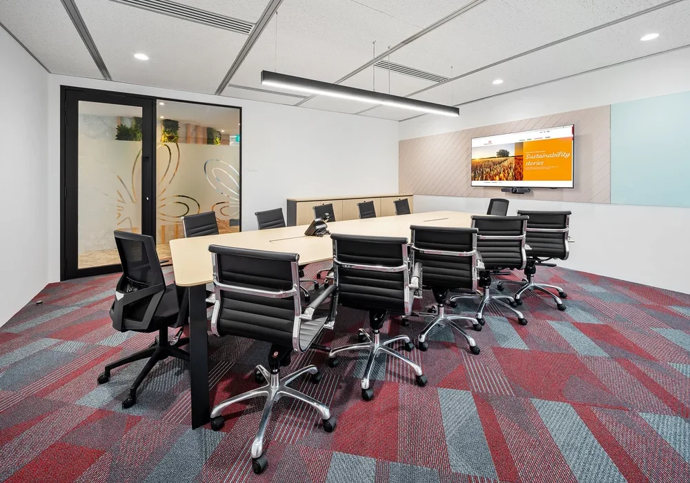 Intersnack boardroom with presentation screen and red patterned flooring