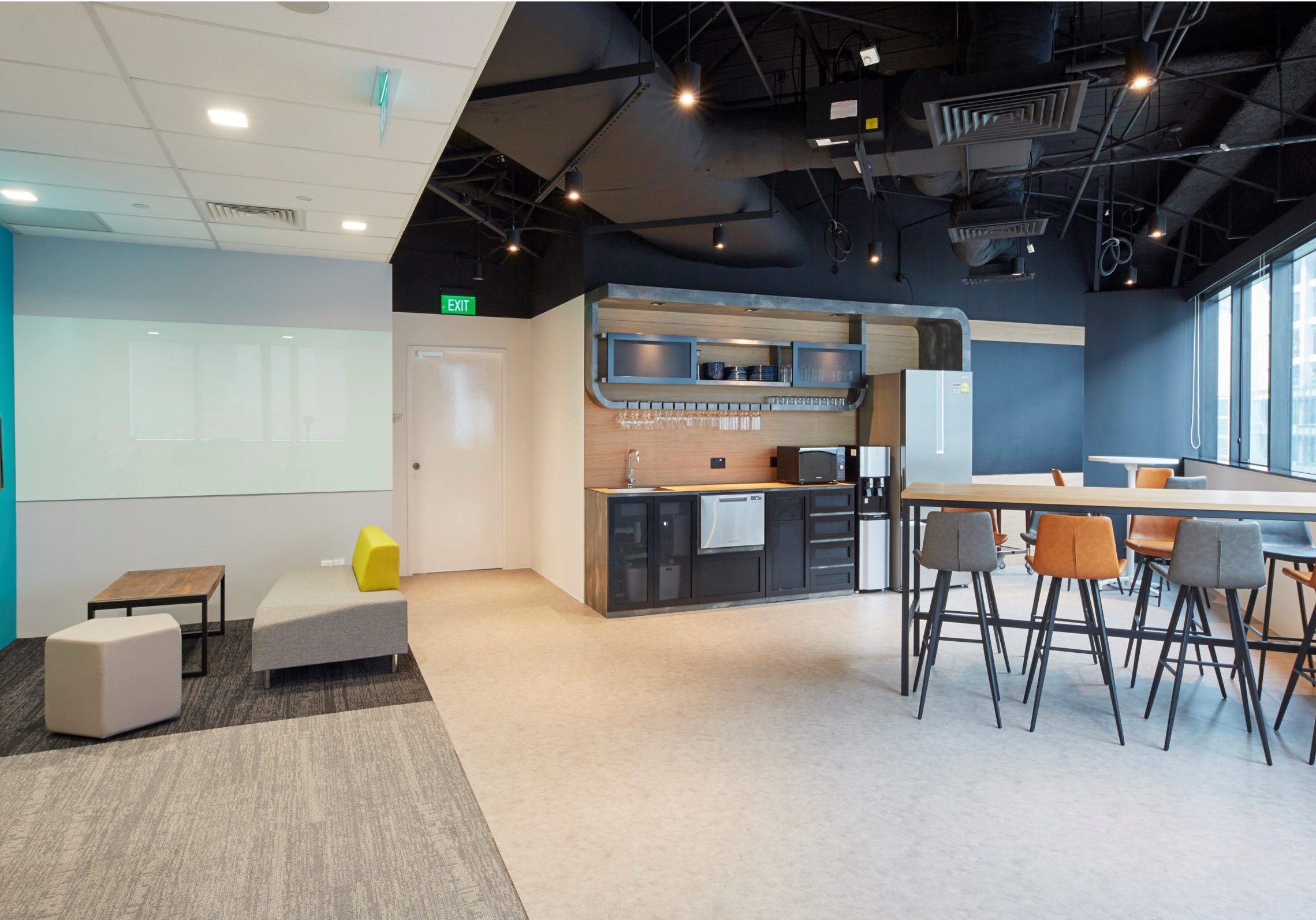 L.E.K. Consulting informal breakout area and pantry with high counter seating