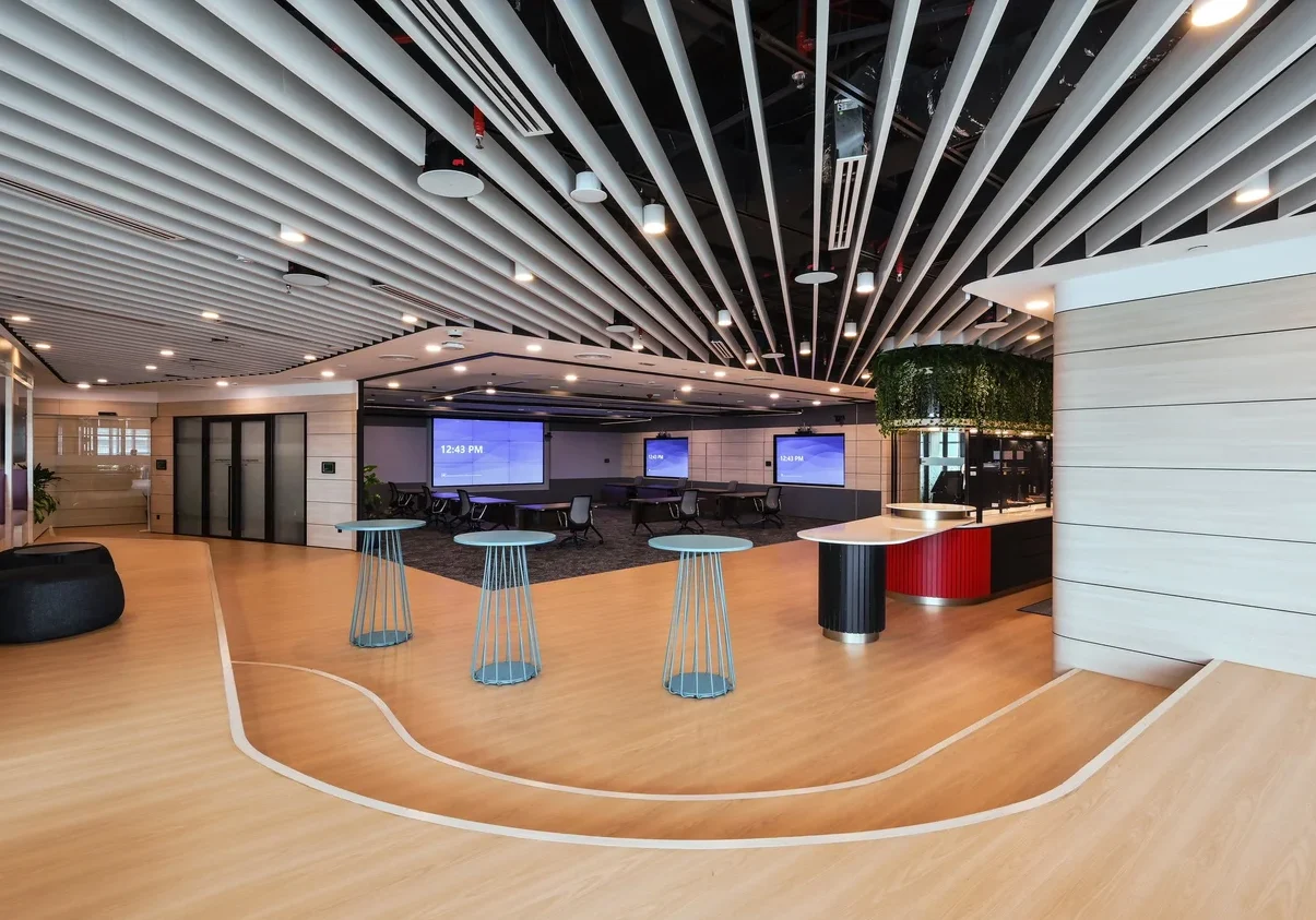 Nestlé office pantry with curved seating and glass-lined interior