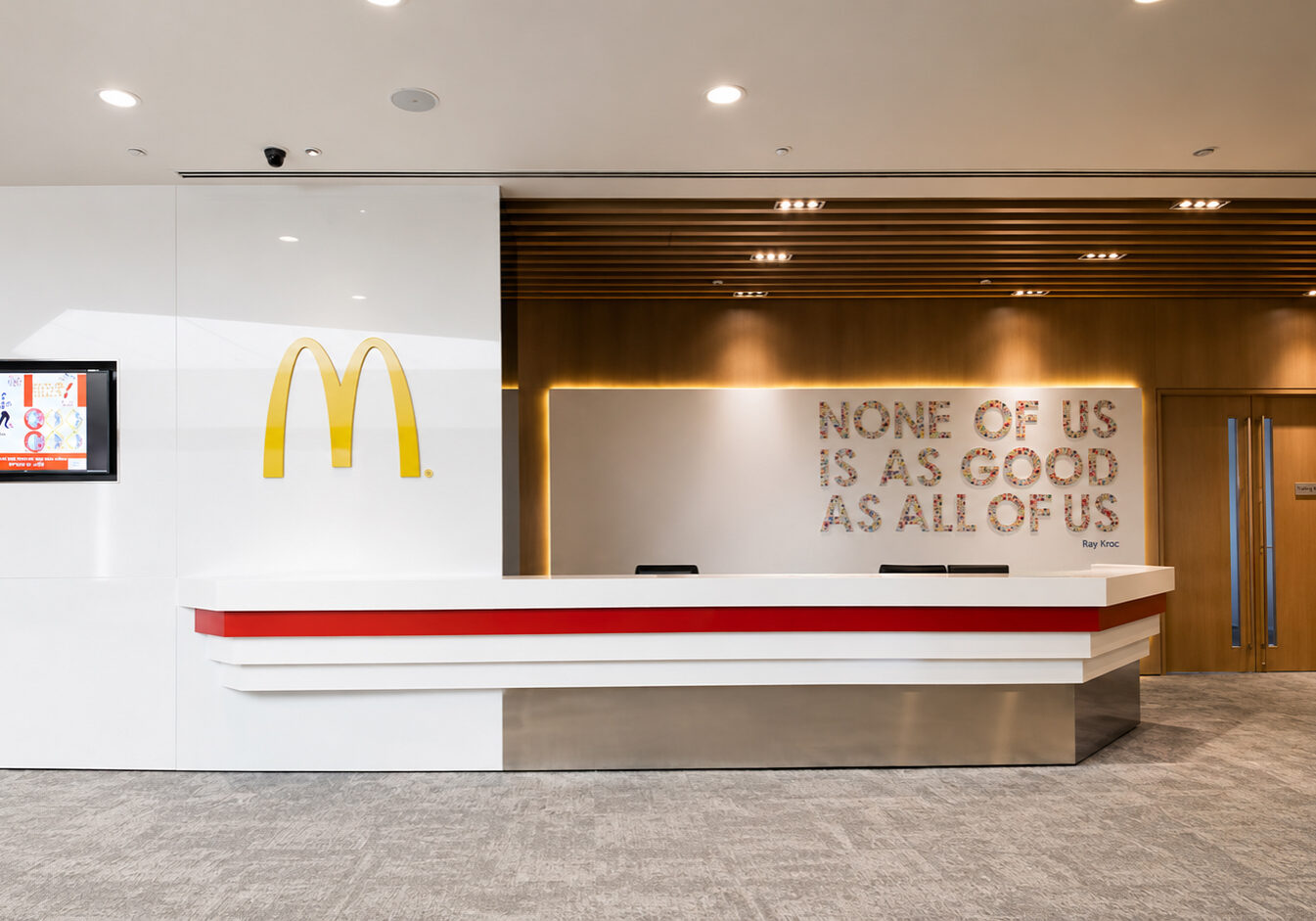 McDonald’s Regional Office reception with colourful seating and branded feature wall