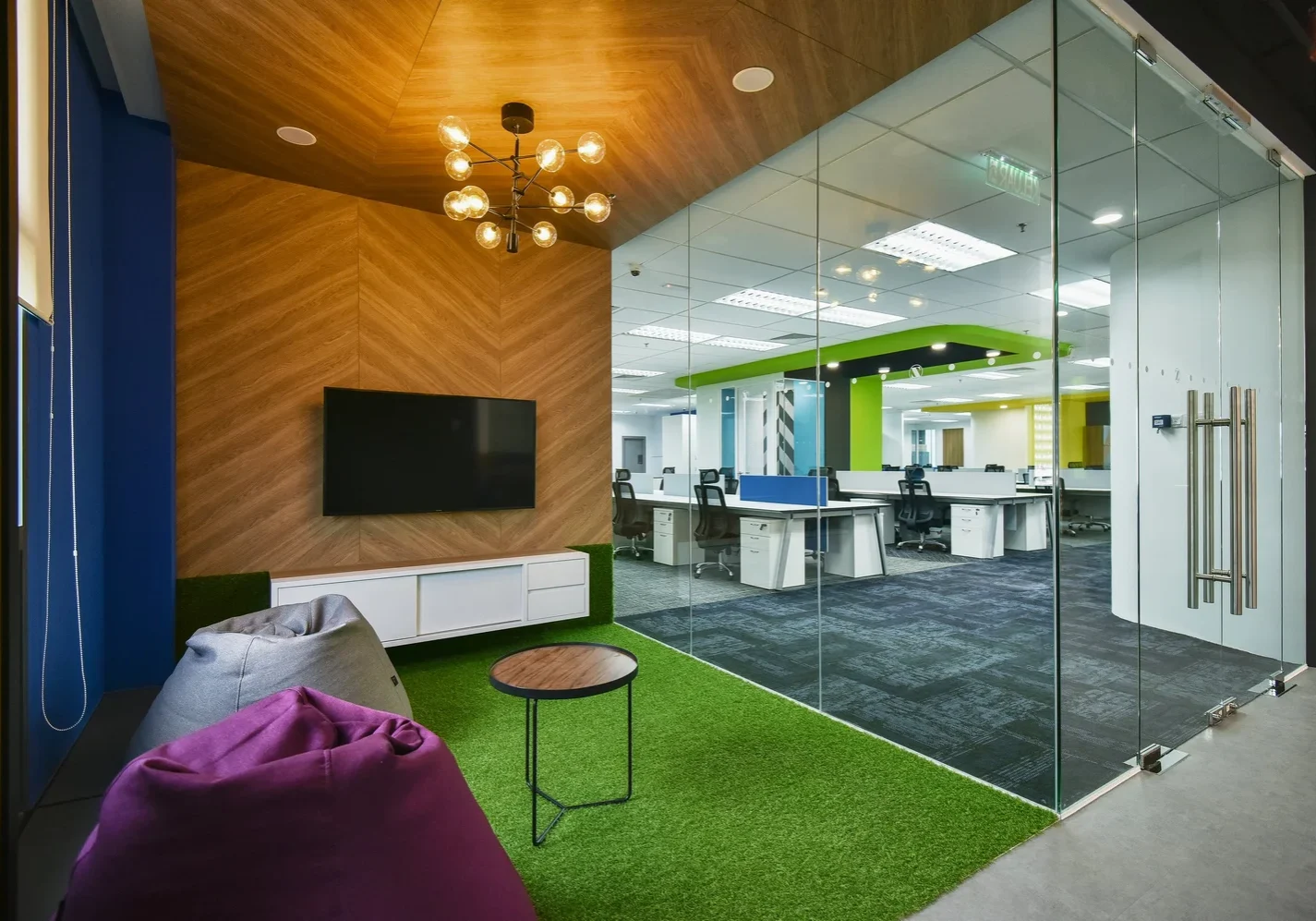 Informal Zimmer Biomet office lounge with beanbags and artificial grass flooring